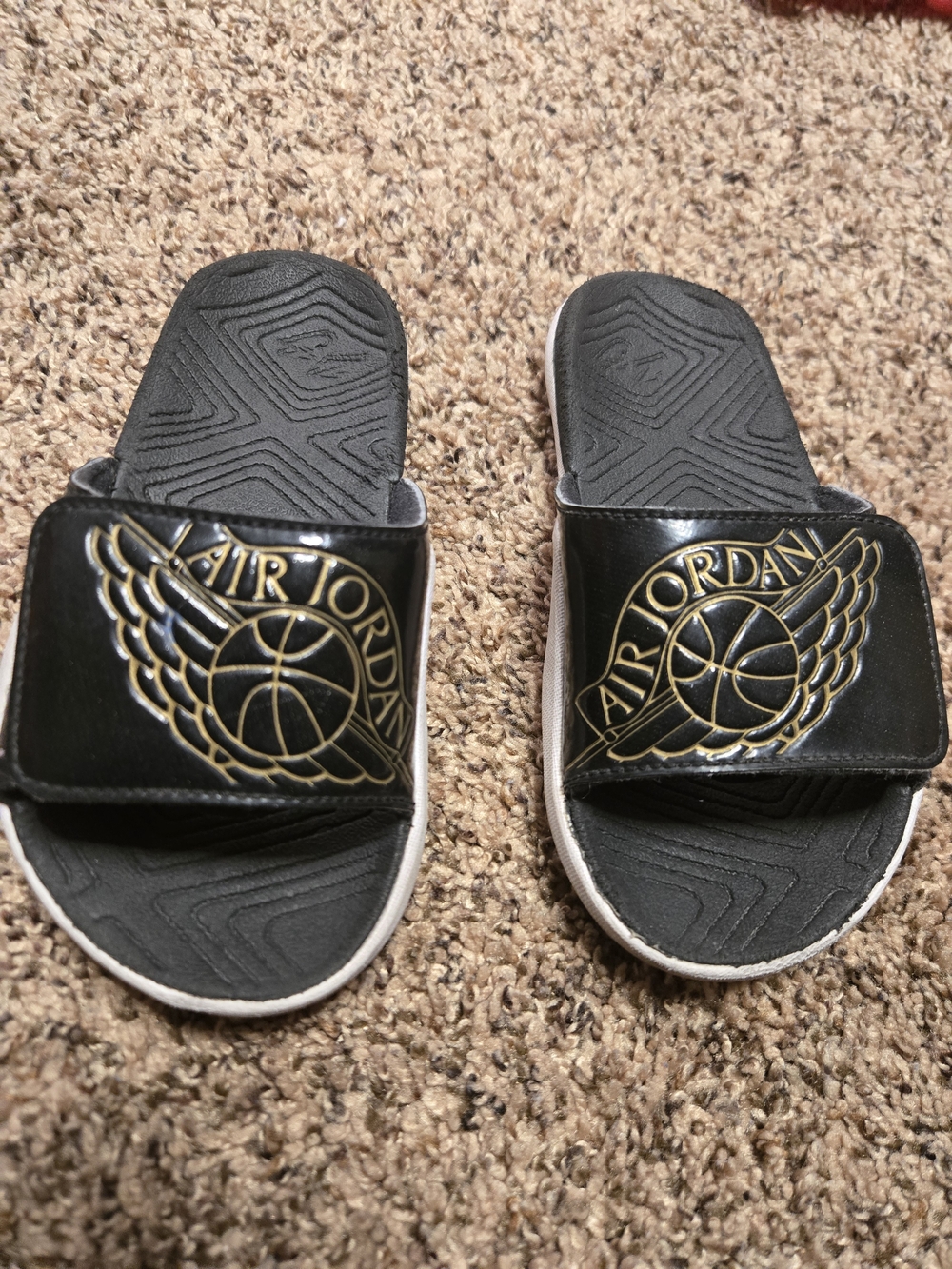 *Size 11* Air Jordan* Black and Gold Slides* Showing signs of being worn*